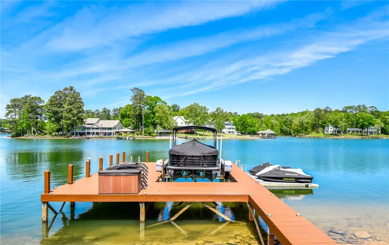 This serene lakeside property offers direct water access and stunning natural surroundings.