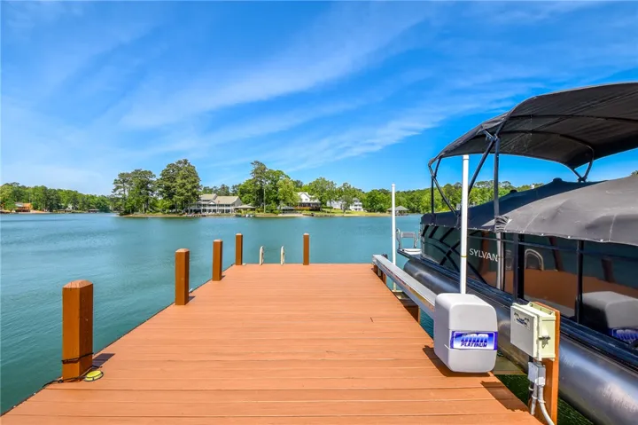 This serene waterfront property offers direct lake access and a private dock for aquatic enjoyment.