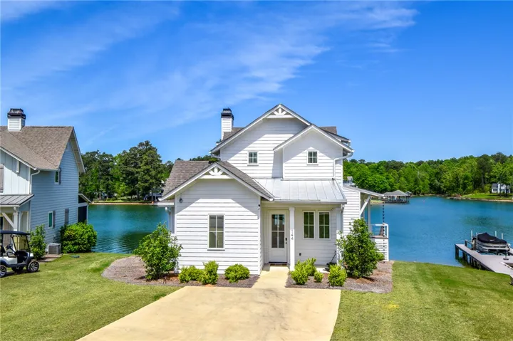 This beautiful waterfront home offers serene lakeside living with picturesque views.