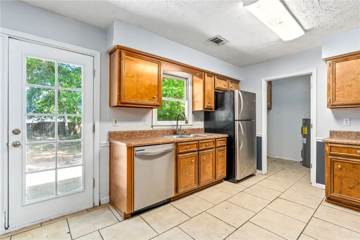 Kitchen - This efficient kitchen offers ample storage and modern appliances for everyday living.
