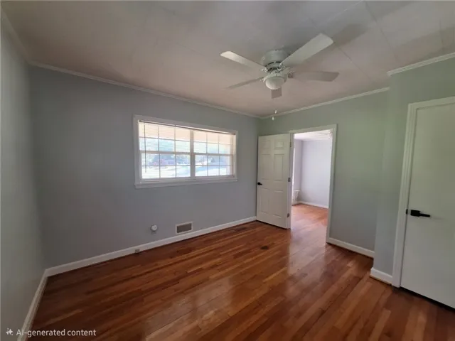 Warm hardwood floors and abundant natural light define this inviting space, ready for your personal touch.