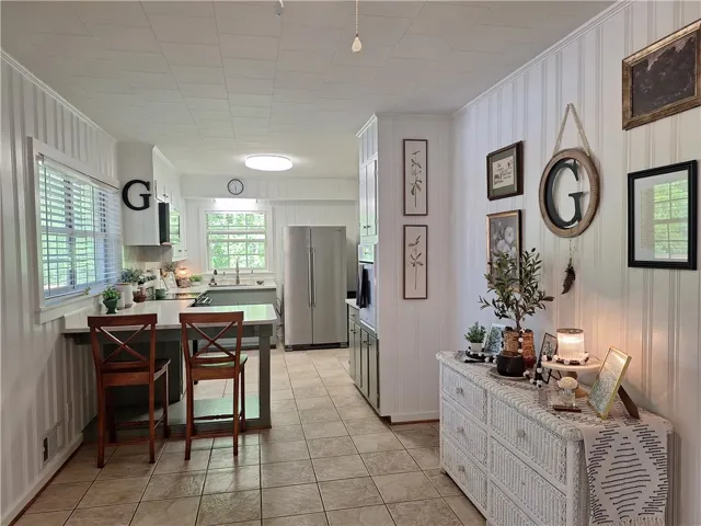 This bright kitchen features ample counter space and natural light, perfect for culinary endeavors.
