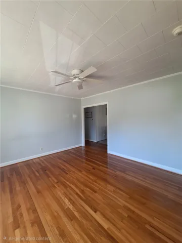 This inviting room features warm hardwood floors, perfect for a comfortable living space.