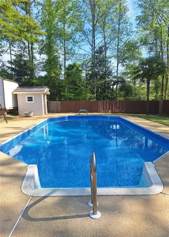 Enjoy outdoor living with a pristine pool and a private, fenced yard.