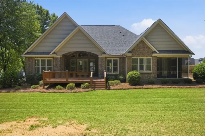 This home features a deck, screened porch, and ample yard space.