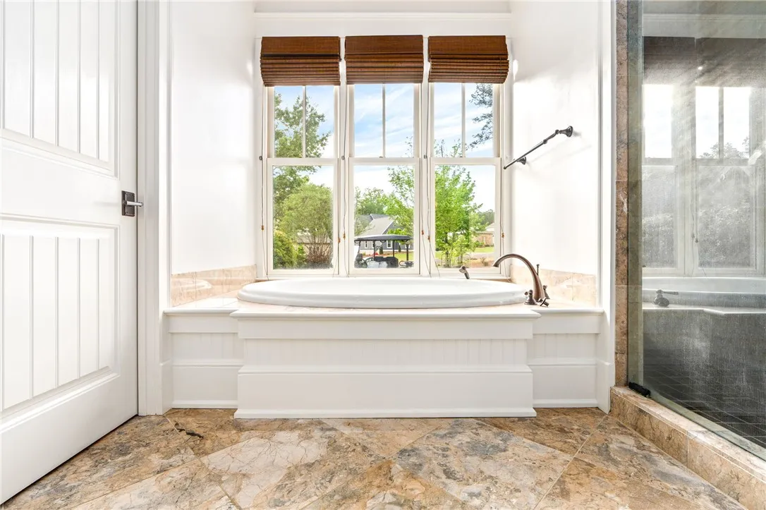 The primary ensuite is flooded with natural light.