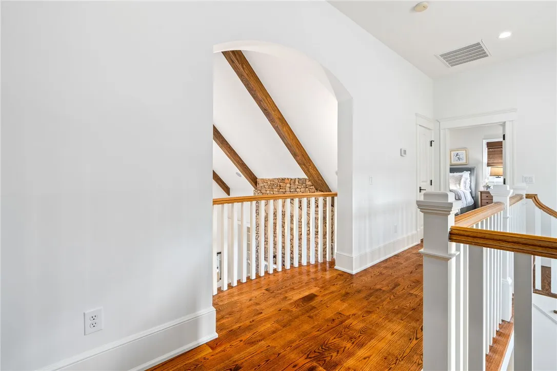 Architectural details add interest to ever nook of this home. From curved doorways to wood beams, no detail was overlooked.