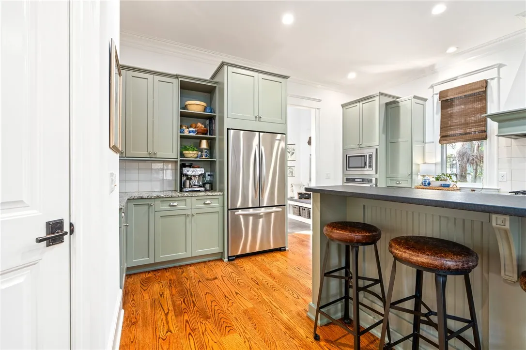 Custom kitchen cabinetry and KitchenAid appliances add to the luxurious feel of the space.