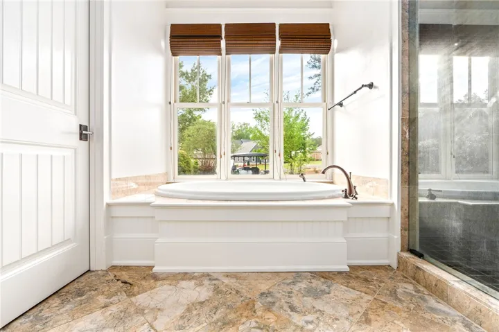 The primary ensuite is flooded with natural light.