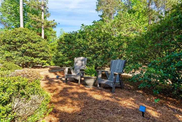 Lush landscape surrounds the home.
