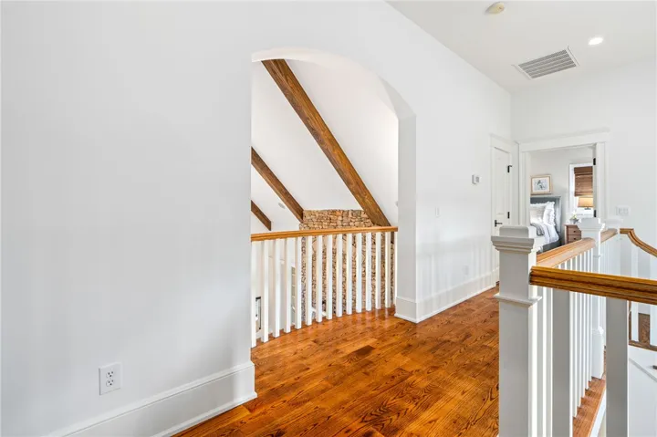 Architectural details add interest to ever nook of this home. From curved doorways to wood beams, no detail was overlooked.