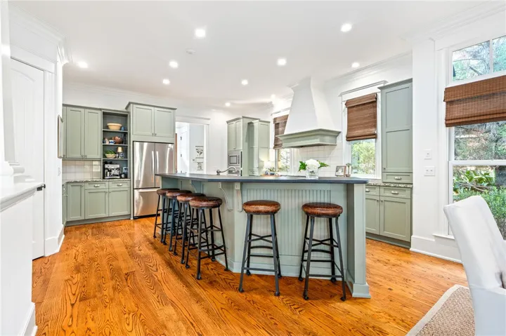Custom kitchen cabinetry and KitchenAid appliances add to the luxurious feel of the space.