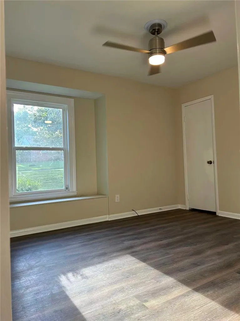 Bright and airy room with durable flooring and natural light offers a comfortable living space.