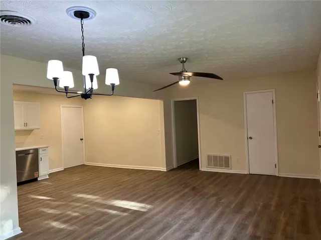 This versatile open-concept space features resilient flooring and ample natural light, ideal for modern living.