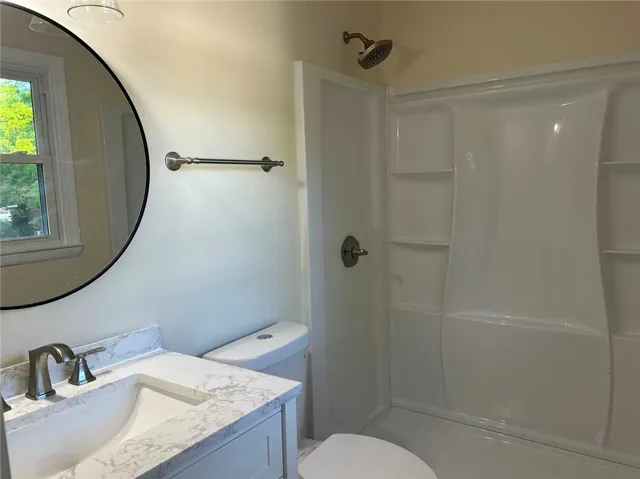This bathroom features a contemporary vanity and a functional shower for everyday living.