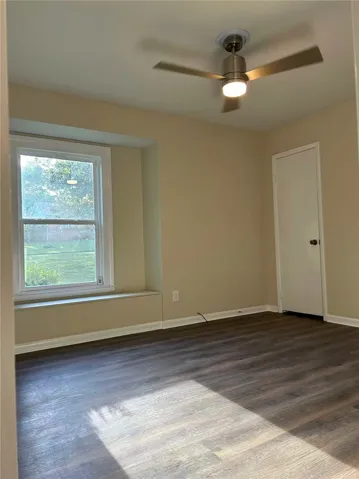 Bright and airy room with durable flooring and natural light offers a comfortable living space.