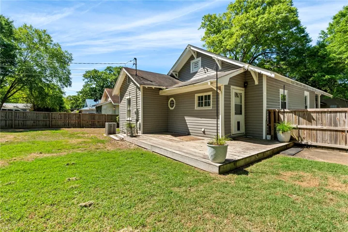 This residence features a spacious private yard and a comfortable patio, perfect for outdoor enjoyment.