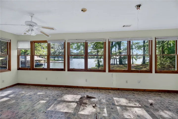 Enjoy peaceful waterfront living with expansive windows and tranquil views of the lake.