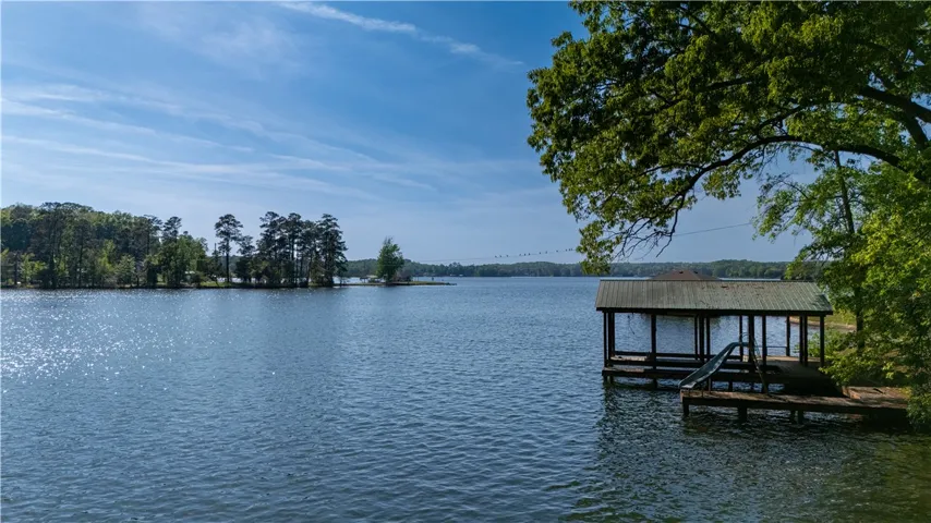 This tranquil waterfront setting includes a private dock, offering direct access to the expansive lake.