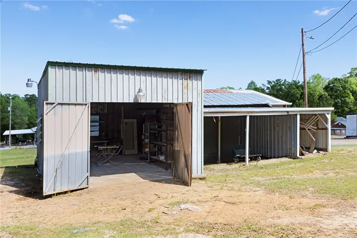 This versatile outbuilding offers ample storage and workspace, perfect for various needs.