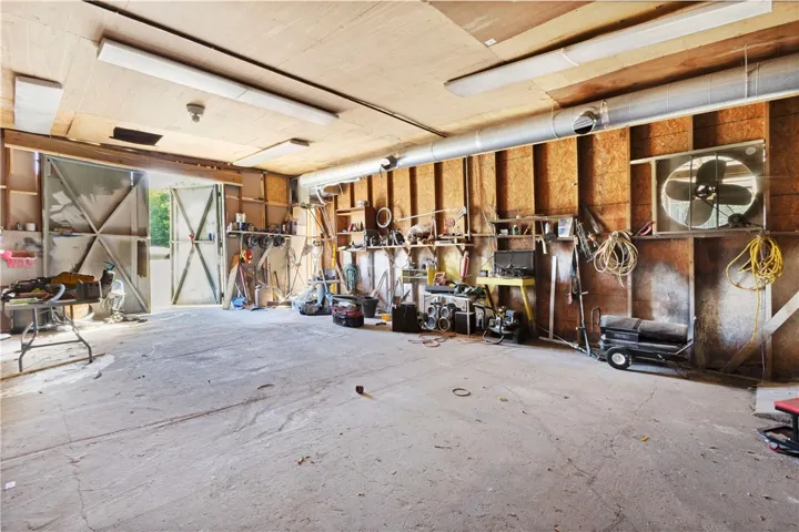 This spacious utility room offers ample storage and direct access to the outdoors.