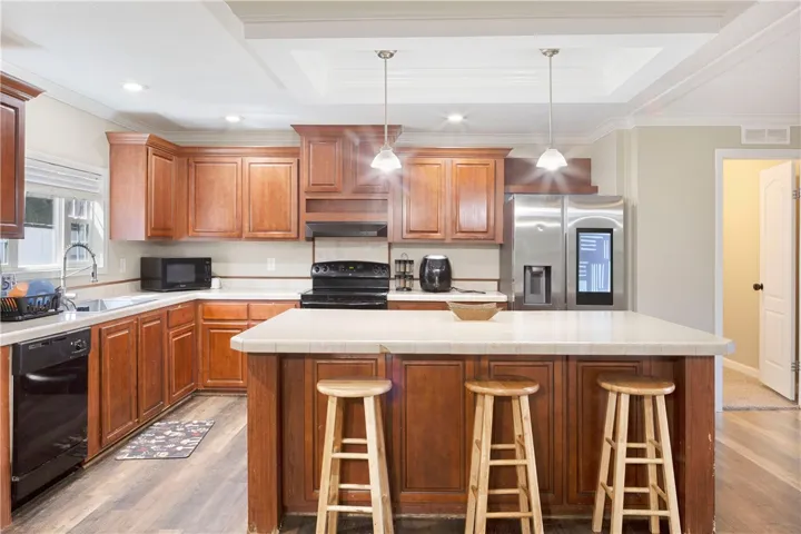 This functional kitchen provides a bright and inviting space for cooking and entertaining.