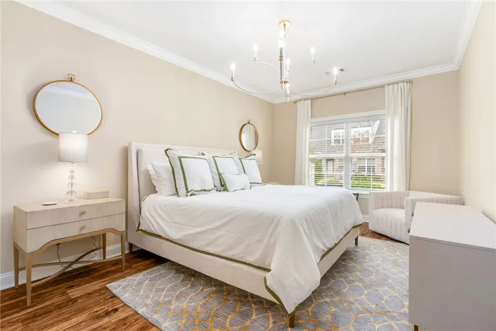 This tranquil bedroom features abundant natural light, offering a peaceful retreat.