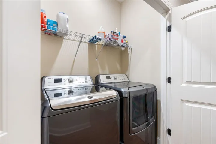 This dedicated space offers convenience with essential appliances, simplifying daily chores.