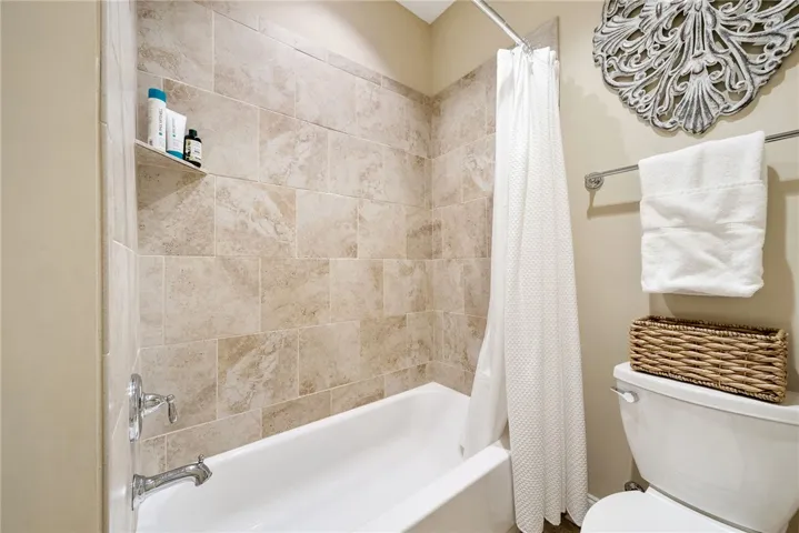 This clean and inviting bathroom offers a perfect blend of comfort and convenience.
