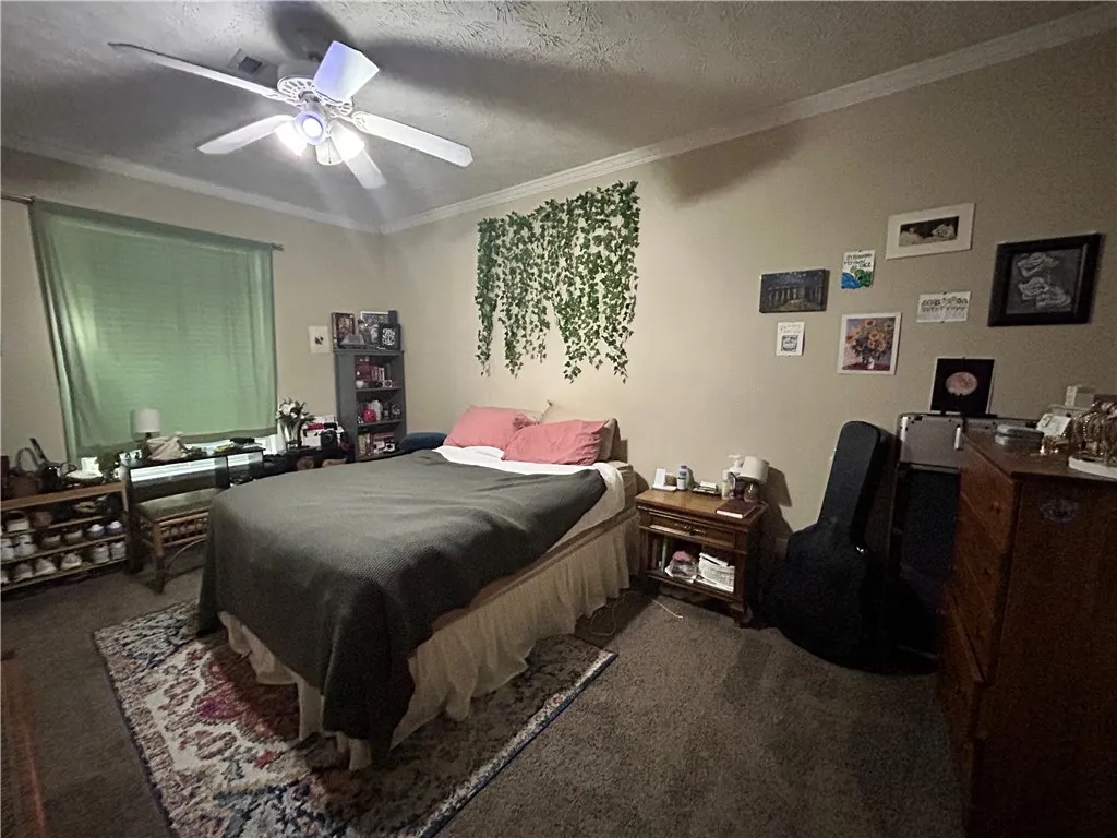 This cozy room features soft lighting and ample space for rest and relaxation.