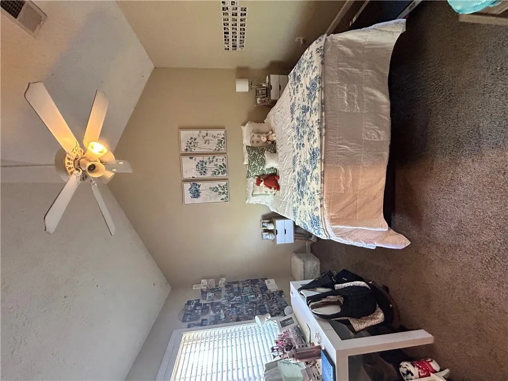 This cozy bedroom offers comfort and natural light for restful living.