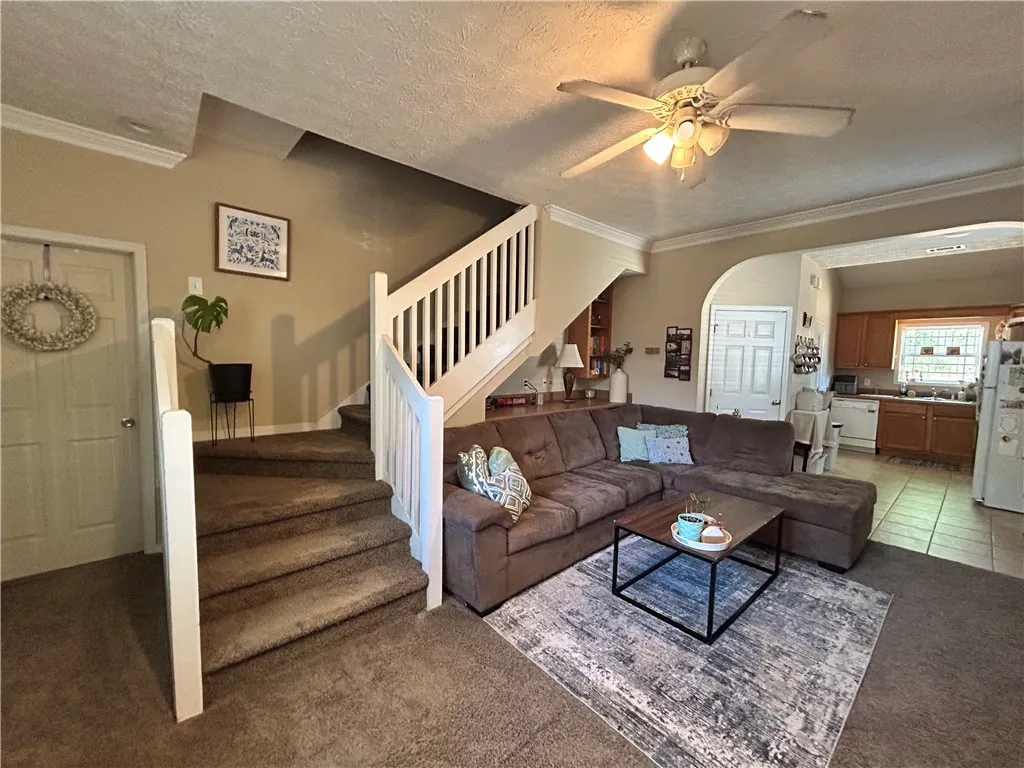 This inviting space combines comfort with practical design, ideal for everyday living and entertaining.