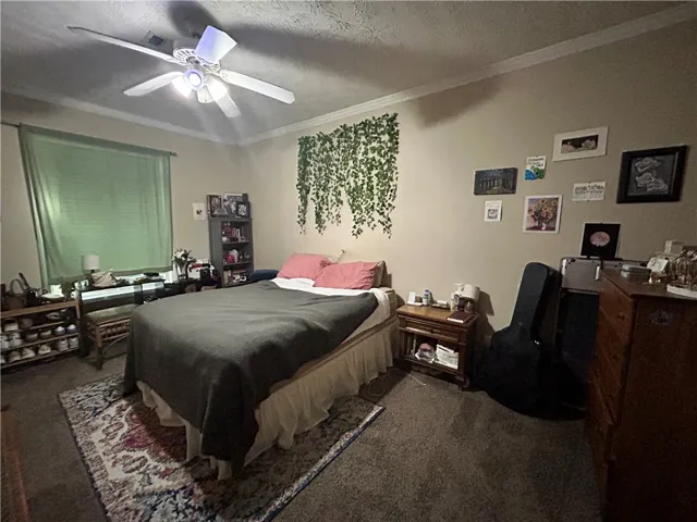 This cozy room features soft lighting and ample space for rest and relaxation.