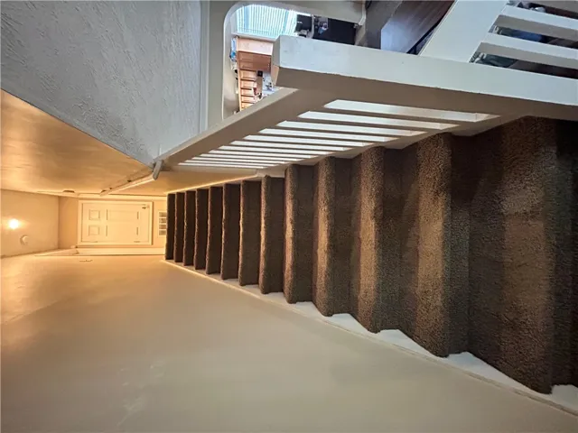 This interior staircase offers seamless movement between levels, blending utility and design.