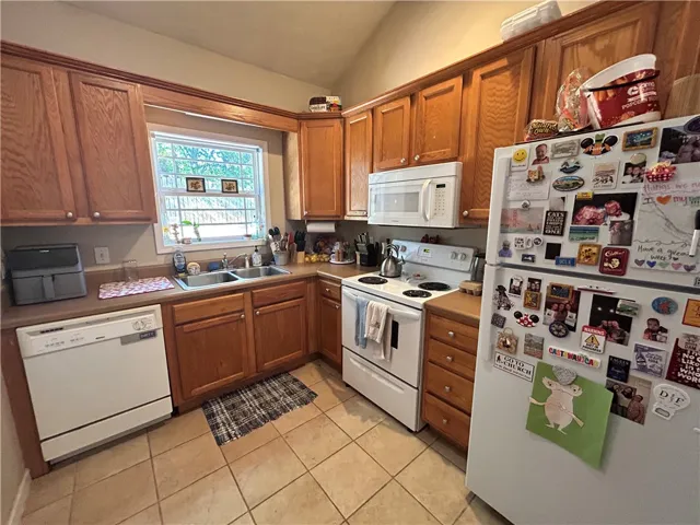 This kitchen offers functional appliances and ample storage in a classic design.