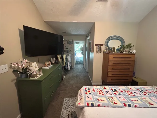 This cozy room offers a comfortable atmosphere with vaulted ceilings.