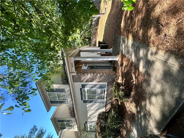 This classic facade features an inviting entryway and traditional architectural details.