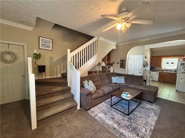 This inviting space combines comfort with practical design, ideal for everyday living and entertaining.