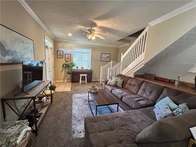 This inviting living room offers comfort and architectural interest, perfect for daily living and entertaining.