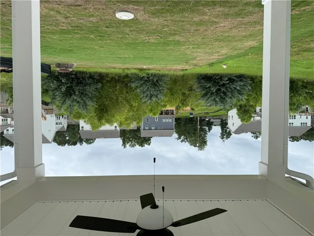 A deep backyard extends to mature trees and a tranquil greenbelt, offering neighborhood privacy.