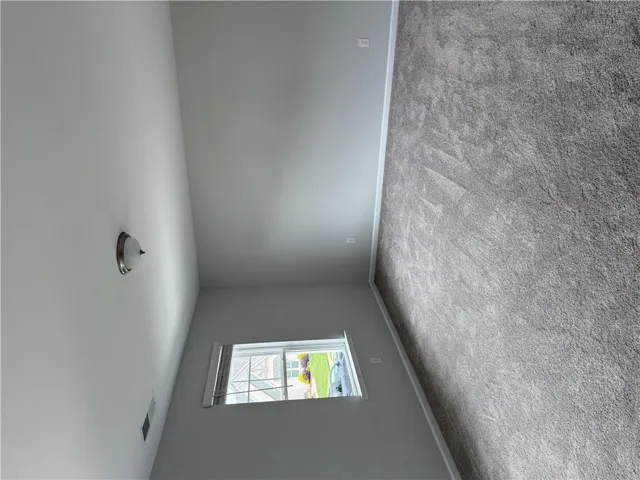 Plush carpeting defines this tranquil space, ready for personalized touches.