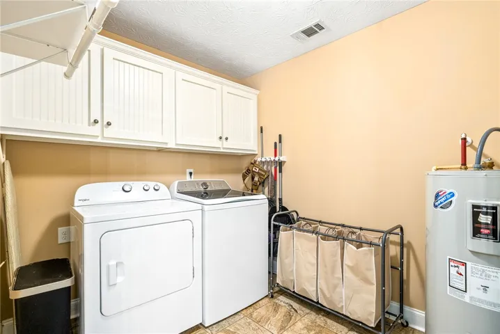 This dedicated laundry room features functional storage and efficient appliances, making chores simple.