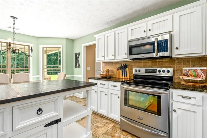 This spacious kitchen offers ample room for culinary endeavors and gatherings.