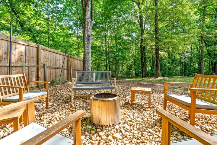 This tranquil outdoor space offers a private retreat surrounded by lush greenery.