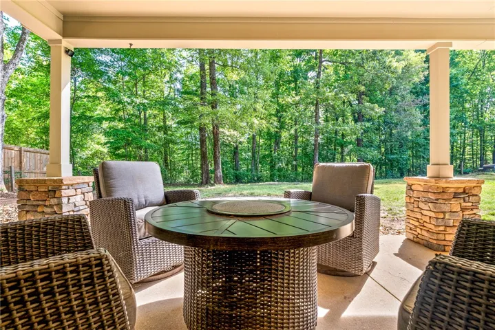 Enjoy tranquil outdoor living on this expansive patio, perfect for entertaining or quiet relaxation.
