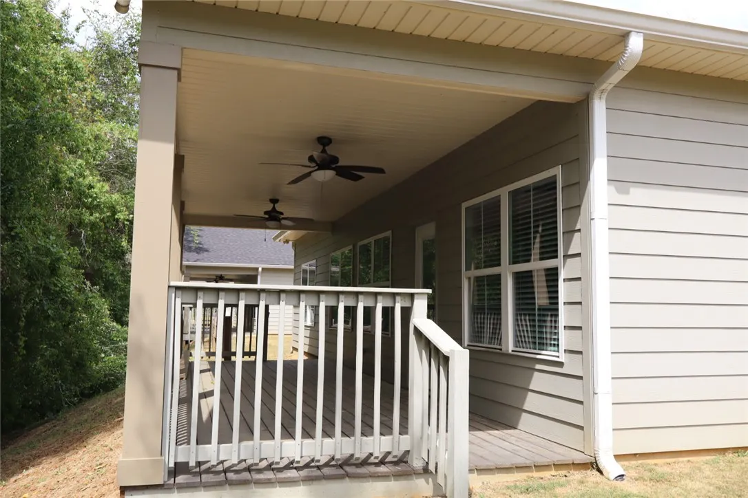 This inviting covered porch provides a seamless transition to the outdoors, perfect for tranquil moments.