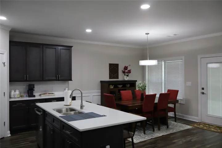 This bright kitchen and dining area offers functional design and modern appeal.