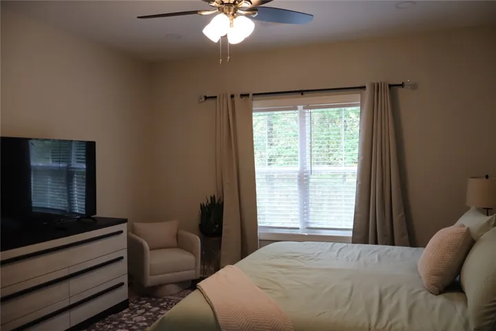 This restful bedroom offers a perfect sanctuary for comfort and tranquility.