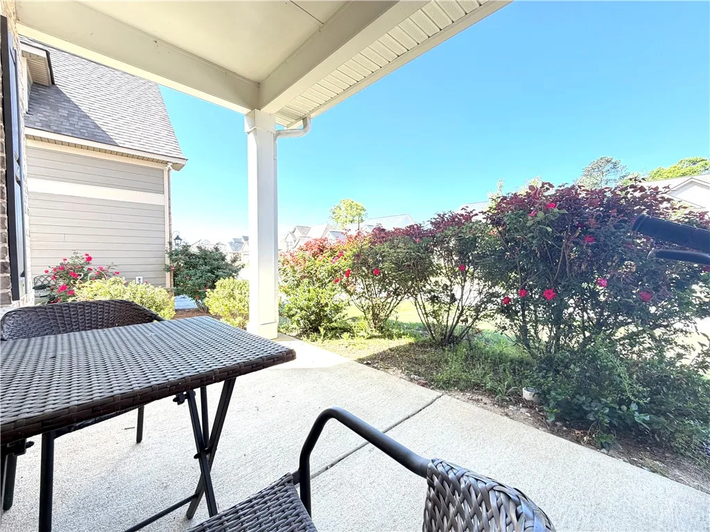 This inviting patio area features ample space for outdoor relaxation and enjoyment.