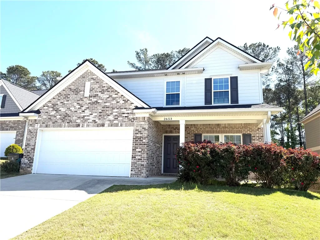 This charming residence features a well-maintained exterior and inviting curb appeal.